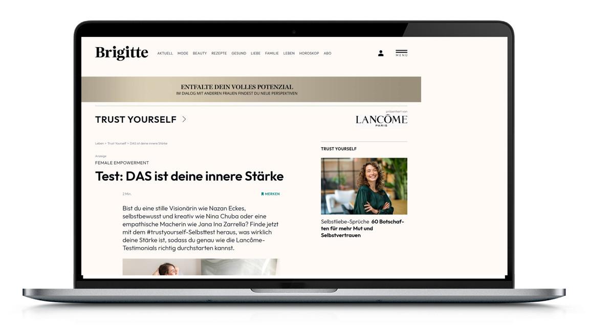 Laptop mit geöffneter Webseite, Werbung für Lancome sichtbar.