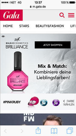 Das Bild zeigt eine Webseite der Marke Gala mit einem Werbebanner für Magic Cosmetics Brilliance Nagellack. Im Fokus steht eine pinke Nagellackflasche, die die Farbe 'Pink Ruby' präsentiert. Der Slogan 'Mix & Match: Kombiniere deine Lieblingsfarben!' lädt zum Experimentieren mit verschiedenen Farben ein. Oben auf der Seite befinden sich Navigationsmenüs mit Optionen wie Home, Stars und Beauty & Fashion. Am unteren Bildschirmrand sind Symbole für die Navigation auf einem mobilen Gerät sichtbar.
#!#
Nagellack,Kosmetik,Brilliance,Pink Ruby,Mix & Match,Gala,Beauty,Mode,Werbung,Mobil